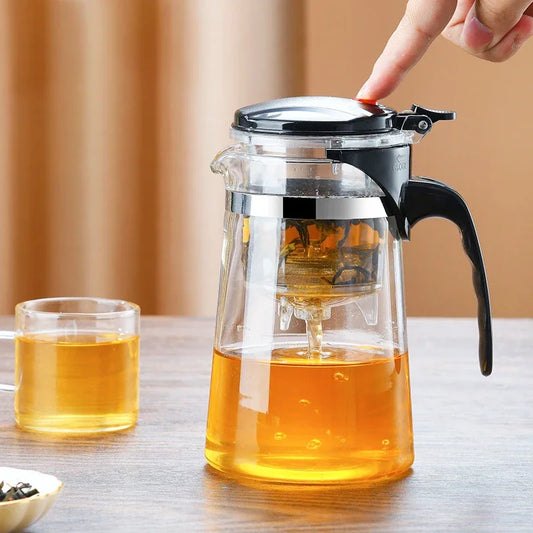 Tetera de vidrio resistente al calor con infusor de acero inoxidable. Ideal para preparar té de flores, Diseño elegante con asa ergonómica para un manejo cómodo.